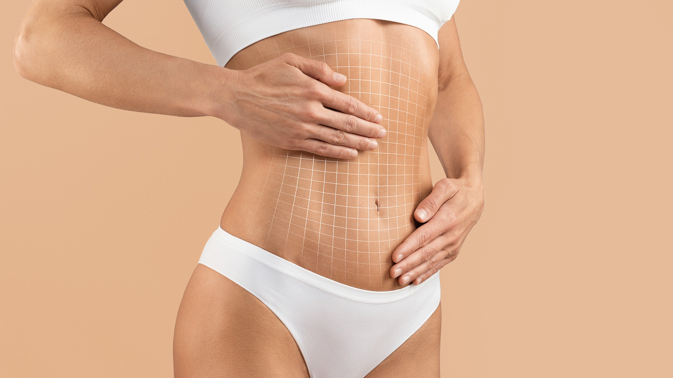 woman touching abdomen after 360 lipo