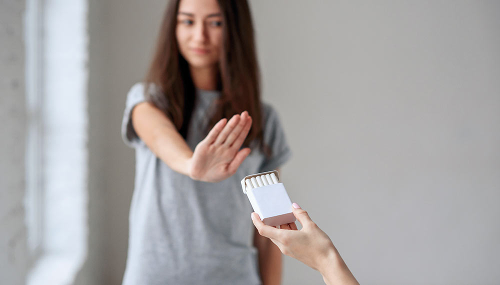 woman saying no to cigarettes before surgery